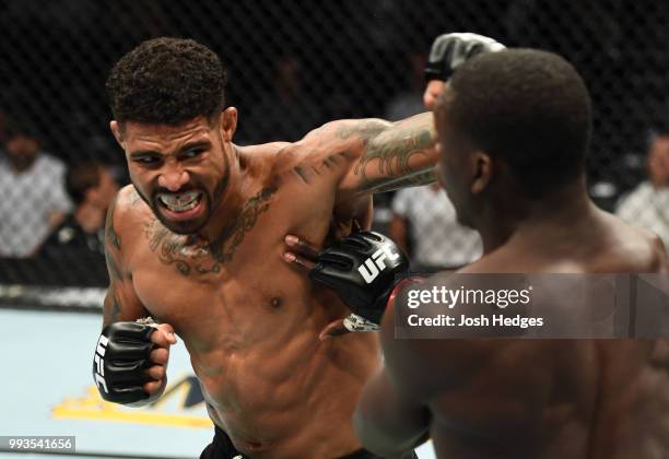 Max Griffin punches Curtis Millender in their welterweight fight during the UFC 226 event inside T-Mobile Arena on July 7, 2018 in Las Vegas, Nevada.