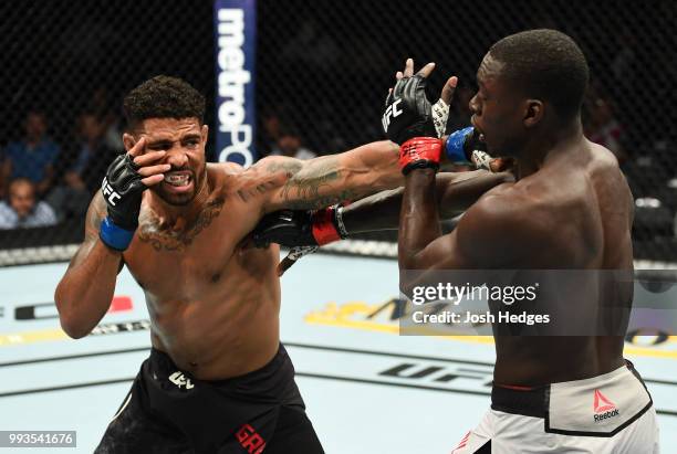 Max Griffin punches Curtis Millender in their welterweight fight during the UFC 226 event inside T-Mobile Arena on July 7, 2018 in Las Vegas, Nevada.