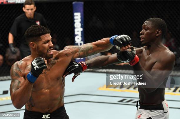 Max Griffin punches Curtis Millender in their welterweight fight during the UFC 226 event inside T-Mobile Arena on July 7, 2018 in Las Vegas, Nevada.