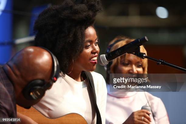 Singer Victory on stage with hosts Cayman Kelly and Michel Wright during SiriusXM's Heart & Soul Channel Broadcasts from Essence Festival on July 7,...