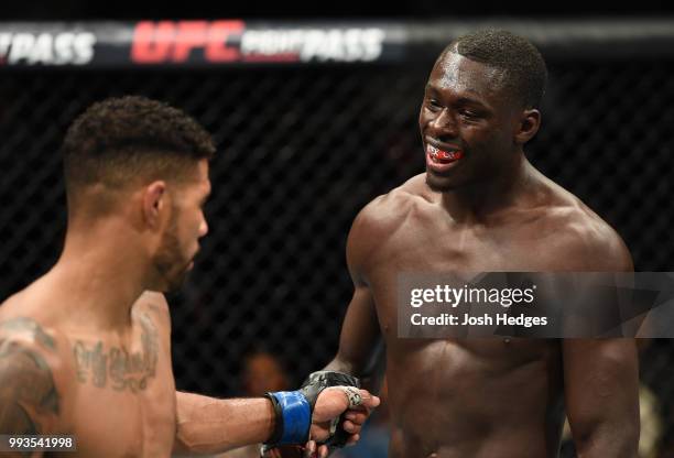 Max Griffin and Curtis Millender touch gloves after their welterweight fight during the UFC 226 event inside T-Mobile Arena on July 7, 2018 in Las...