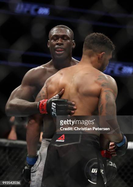 Curtis Millender hugs Max Griffin after their welterweight fight during the UFC 226 event inside T-Mobile Arena on July 7, 2018 in Las Vegas, Nevada.