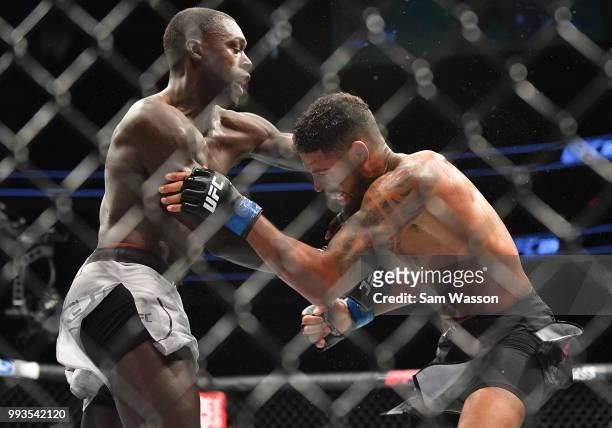Curtis Millender punches Max Griffin during their welterweight fight at T-Mobile Arena on July 7, 2018 in Las Vegas, Nevada. Millender won by...