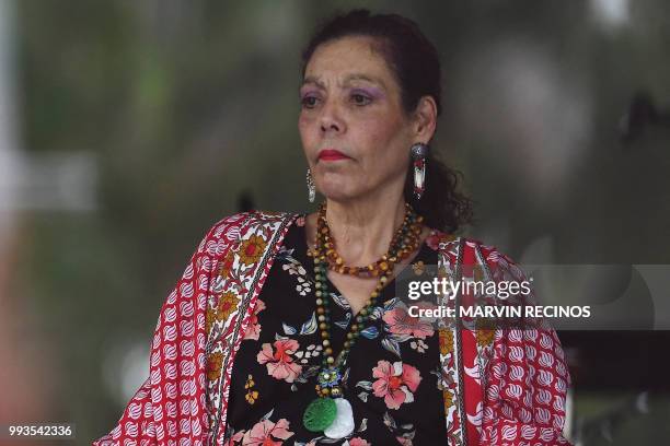 Nicaraguan Vice President Rosario Murillo looks on as her husband, President Daniel Ortega speaks to supporters during the government-called "Walk...