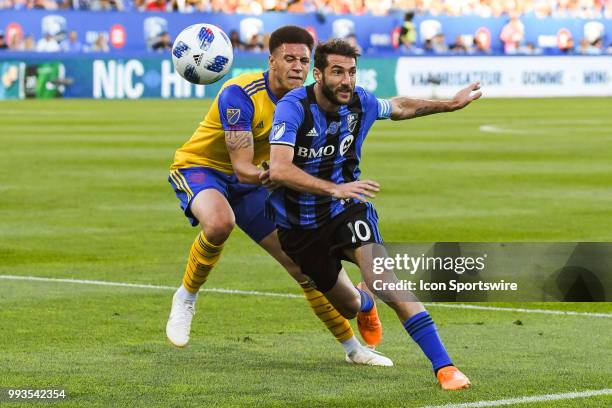 Colorado Rapids defender Kortne Ford holds on Montreal Impact midfielder Ignacio Piatti to stop him from reaching the ball during the Colorado Rapids...