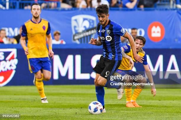 Montreal Impact midfielder Alejandro Silva runs away with the ball leaving Colorado Rapids player behind during the Colorado Rapids versus the...