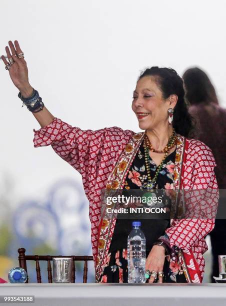 Nicaraguan Vice President Rosario Murillo looks on as her husband, President Daniel Ortega speaks to supporters during the government-called "Walk...