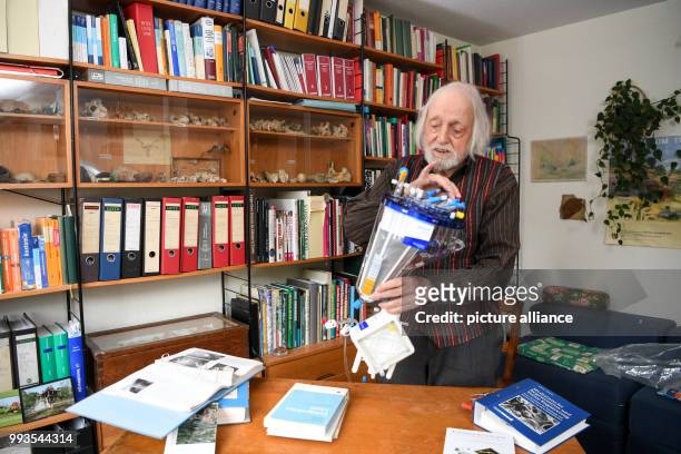 June 2018, Senden, Germany: Age researcher Klaus Sames holds his books inside his office. He is a cryonics researcher, the the low-temperature...