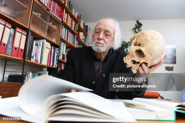 June 2018, Senden, Germany: Age researcher Klaus Sames holds his books inside his office. He is a cryonics researcher, the the low-temperature...