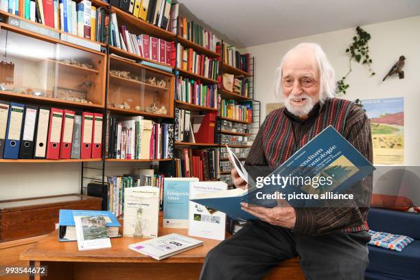 June 2018, Senden, Germany: Age researcher Klaus Sames holds his books inside his office. He is a cryonics researcher, the the low-temperature...