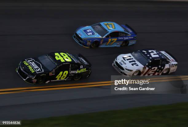 Jimmie Johnson, driver of the Lowe's for Pros Chevrolet, leads a pack of cars during the Monster Energy NASCAR Cup Series Coke Zero Sugar 400 at...