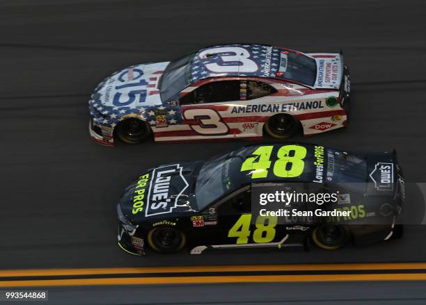 Jimmie Johnson, driver of the Lowe's for Pros Chevrolet, leads Austin Dillon, driver of the American Ethanol e15 Chevrolet, during the Monster Energy...