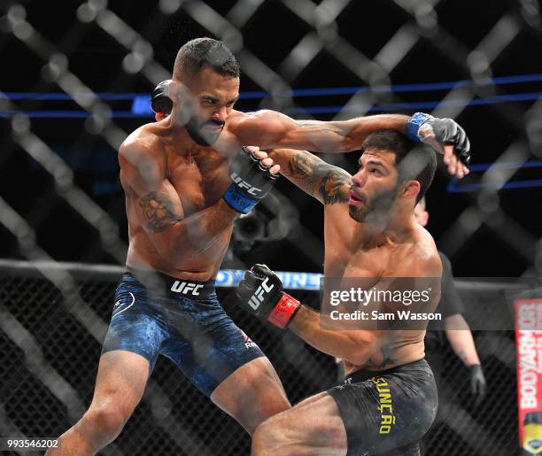 Rob Font throws a punch against Raphael Assuncao during their bantamweight fight at T-Mobile Arena on July 7, 2018 in Las Vegas, Nevada. Assuncao won...