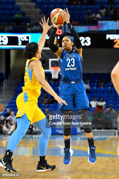 Minnesota Lynx forward Maya Moore shoots against Chicago Sky forward Gabby Williams on July 7, 2018 at the Wintrust Arena in Chicago, Illinois.