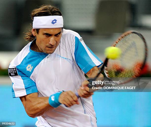 Spain's David Ferrer returns the ball to Britain's Andy Murray during their Madrid Masters tennis match on May 14, 2010 at the Caja Magic sports...