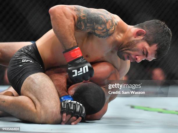 Raphael Assuncao throws a punch against Rob Font during their bantamweight fight at T-Mobile Arena on July 7, 2018 in Las Vegas, Nevada. Assuncao won...