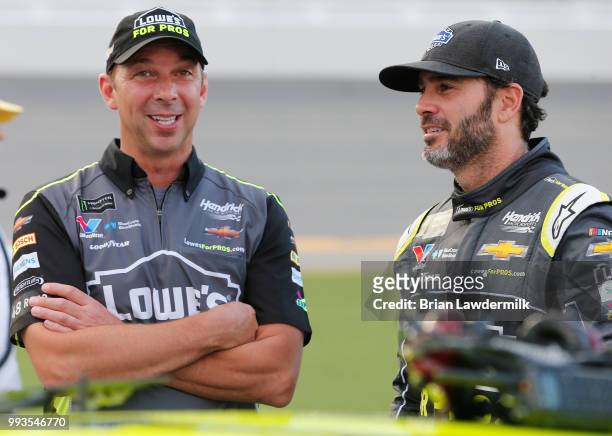 Jimmie Johnson, driver of the Lowe's for Pros Chevrolet, talks with his crew chief, Chad Knaus, during the Monster Energy NASCAR Cup Series Coke Zero...