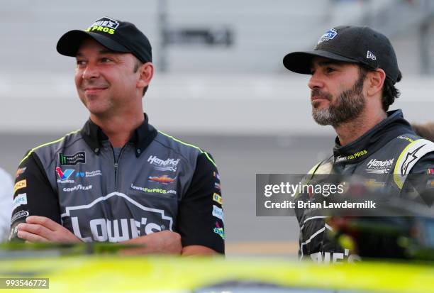 Jimmie Johnson, driver of the Lowe's for Pros Chevrolet, talks with his crew chief, Chad Knaus, during the Monster Energy NASCAR Cup Series Coke Zero...