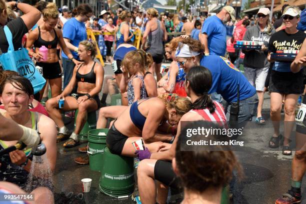 Runners rest following their race during the Women's Division of the 91st Running of the Mount Marathon Race on July 4, 2018 in Seward, Alaska. The...