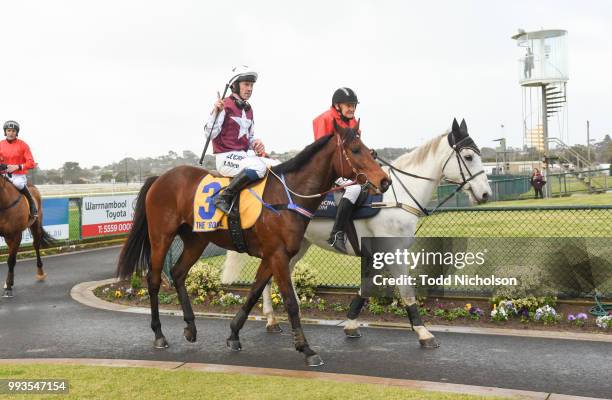Bit of a Lad ridden by John Allen returns after the Greg Bull Painting 1JW Hurdle at Warrnambool Racecourse on July 08, 2018 in Warrnambool,...
