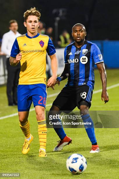 Montreal Impact defender Chris Duvall and Colorado Rapids midfielder Sam Nicholson look at the ball rolling away during the Colorado Rapids versus...