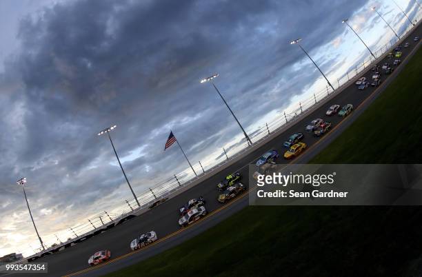 Chase Elliott, driver of the Hooters Chevrolet, leads a pack of cars during the Monster Energy NASCAR Cup Series Coke Zero Sugar 400 at Daytona...