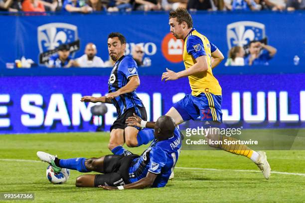 Montreal Impact defender Rod Fanni tackles the ball from Colorado Rapids forward Jack McBean during the Colorado Rapids versus the Montreal Impact...