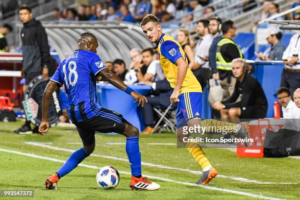 Montreal Impact defender Chris Duvall steals the control of the ball to Colorado Rapids defender Deklan Wynne during the Colorado Rapids versus the...
