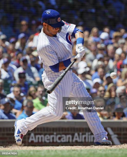 Willson Contreras of the Chicago Cubs bats against the Cincinnati Reds at Wrigley Field on July 6, 2018 in Chicago, Illinois. The Reds defeated the...