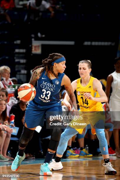 Seimone Augustus of the Minnesota Lynx handles the ball against the Allie Quigley of the Chicago Sky on July 07, 2018 at the Wintrust Arena in...