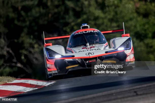 The Acura DPi of Dane Cameron and Juan Pablo Montoya, of Colombia, races on the track during practice for the IMSA WeatherTech Series race at...