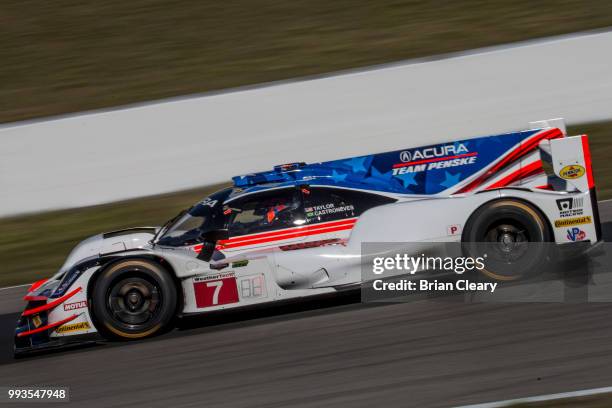 The Acura DPi of Ricky Taylor and Helio Castroneves of Brazil, races on the track during practice for the IMSA WeatherTech Series race at Canadian...