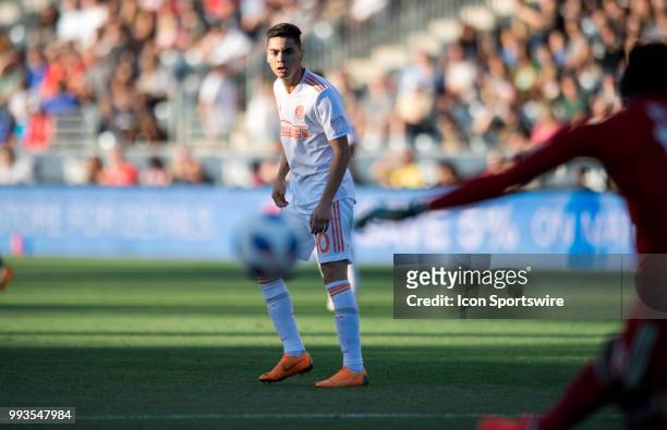 Atlanta United Midfielder Miguel Almiron watches as Union Keeper Andre Blake clears the ball in the first half during the game between Atlanta United...