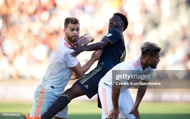 Atlanta United Defender Leandro Gonzalez Pirez uses Forward Josef Martinez to push off Union Forward CJ Sapong on a free kick in the first half...