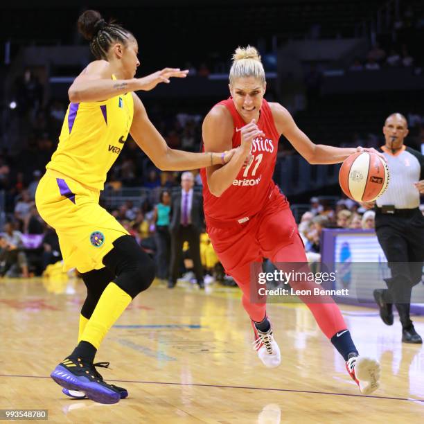 Elena Delle Donne of the Washington Mystics handles the ball against Candace Parker of the Los Angeles Sparks during a WNBA basketball game at...