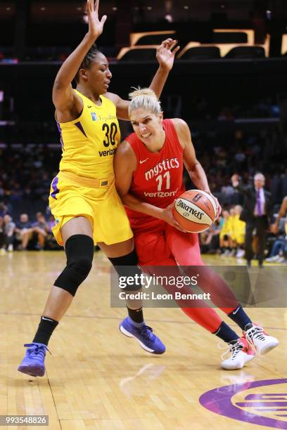 Elena Delle Donne of the Washington Mystics handles the ball against Nneka Ogwumike of the Los Angeles Sparks during a WNBA basketball game at...