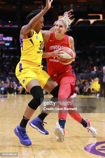 Elena Delle Donne of the Washington Mystics handles the ball against Nneka Ogwumike of the Los Angeles Sparks during a WNBA basketball game at...