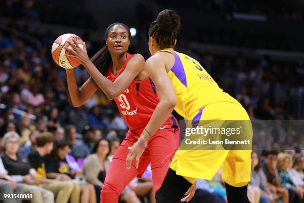 LaToya Sanders of the Washington Mystics handles the ball against Candace Parker of the Los Angeles Sparks during a WNBA basketball game at Staples...