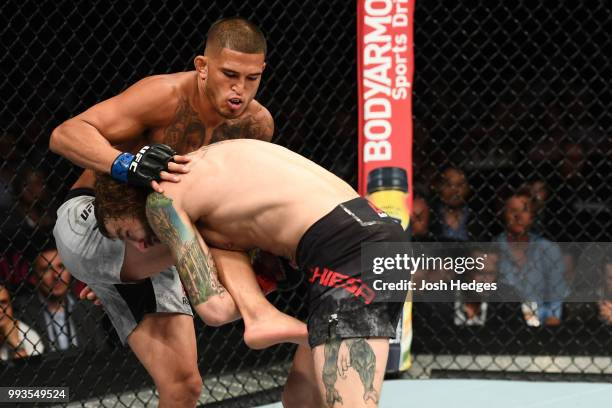 Michael Chiesa goes for a takedown against Anthony Pettis in their lightweight fight during the UFC 226 event inside T-Mobile Arena on July 7, 2018...