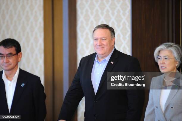 Taro Kono, Japan's foreign minister, left, Mike Pompeo, U.S. Secretary of state, center, and Kang Kyung-wha, South Korea's foreign minister, arrive...