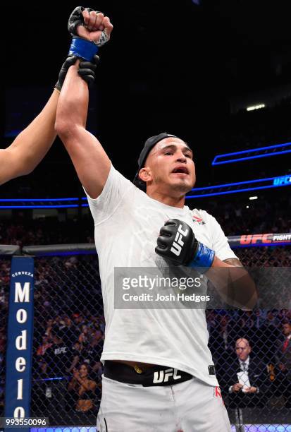 Anthony Pettis raises his hand in a win over Michael Chiesa in their lightweight fight during the UFC 226 event inside T-Mobile Arena on July 7, 2018...