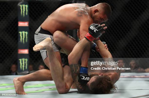 Anthony Pettis punches Michael Chiesa in their lightweight fight during the UFC 226 event inside T-Mobile Arena on July 7, 2018 in Las Vegas, Nevada.