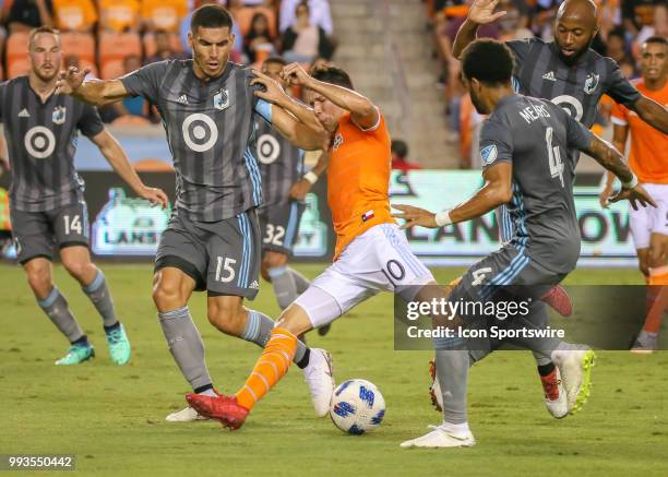 Minnesota United defender Michael Boxall and Houston Dynamo midfielder Tomas Martinez fight for ball during the soccer match between the Minnesota...