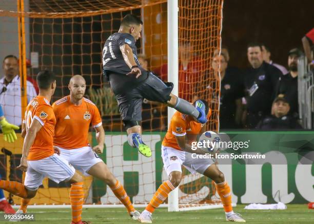 Minnesota United forward Christian Ramirez strikes on goal during the soccer match between the Minnesota United FC and Houston Dynamo on July 7, 2018...