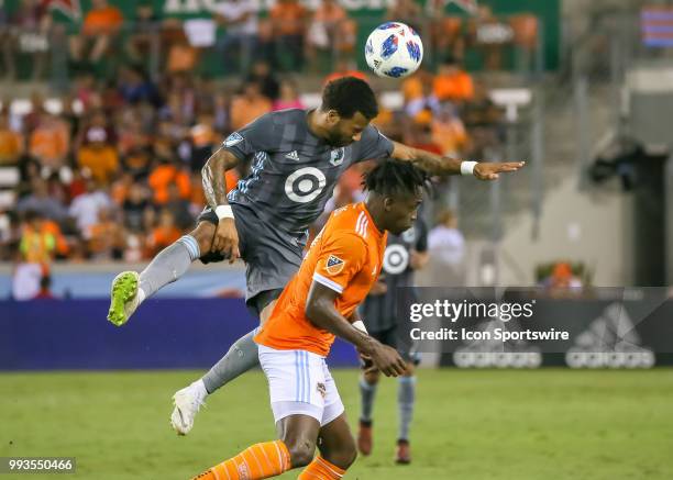 Minnesota United defender Tyrone Mears and Houston Dynamo forward Alberth Elis go up for a header during the soccer match between the Minnesota...