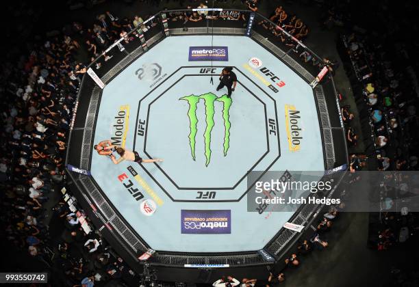An overhead view of Anthony Pettis and Michael Chiesa exhanging blows in their lightweight fight during the UFC 226 event inside T-Mobile Arena on...