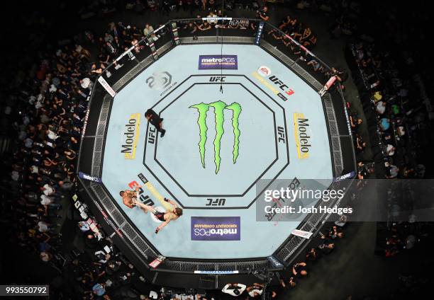 An overhead view of Anthony Pettis and Michael Chiesa exhanging blows in their lightweight fight during the UFC 226 event inside T-Mobile Arena on...