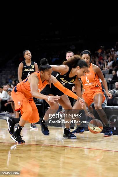 Alex Bentley of the Connecticut Sun and Jaime Nared of the Las Vegas Aces fight for the ball during the game between the two teams on July 7, 2018 at...