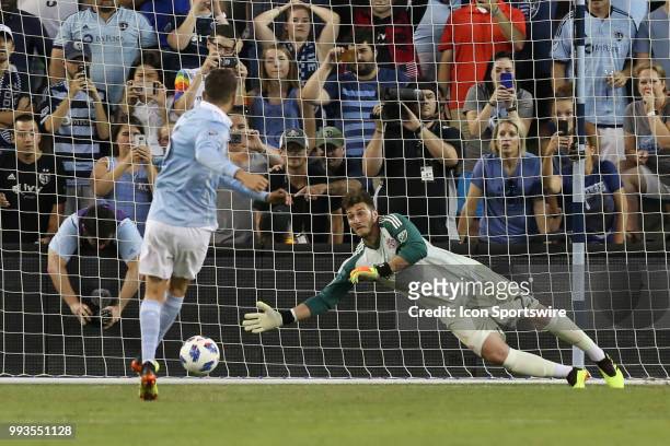 Sporting Kansas City midfielder Ilie Sanchez scores against Toronto FC goalkeeper Alex Bono on a penalty kick in the second half of an MLS match...