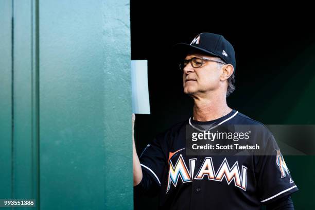Manager Don Mattingly of the Miami Marlins makes final preparations before the game against the Washington Nationals at Nationals Park on July 07,...